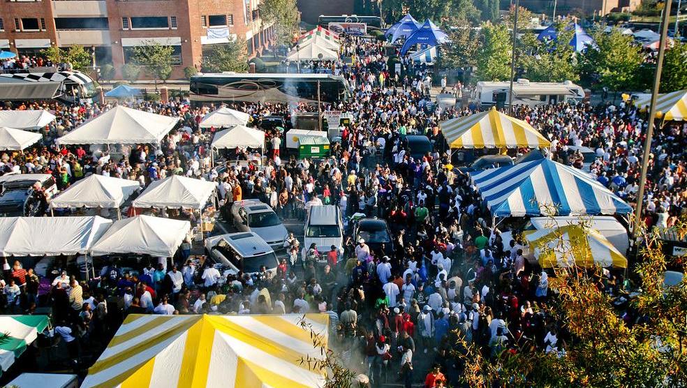 Homecoming Tailgate, a sea of multicolored tents and people.